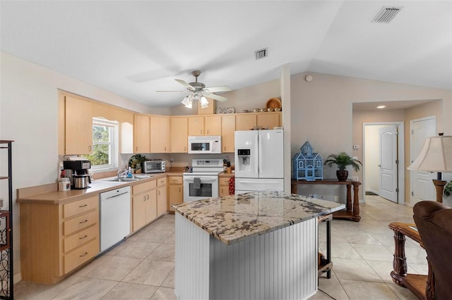 1715 Queen Palm Dr, Edgewater, FL 32132 - kitchen with white appliances, light brown cabinetry, vaulted ceiling, a sink, and a ceiling fan