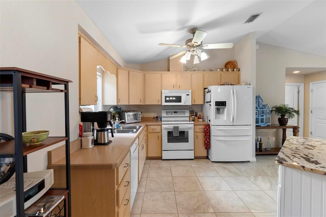 1715 Queen Palm Dr, Edgewater, FL 32132 - kitchen featuring white appliances, light brown cabinetry, lofted ceiling, light countertops, and a ceiling fan