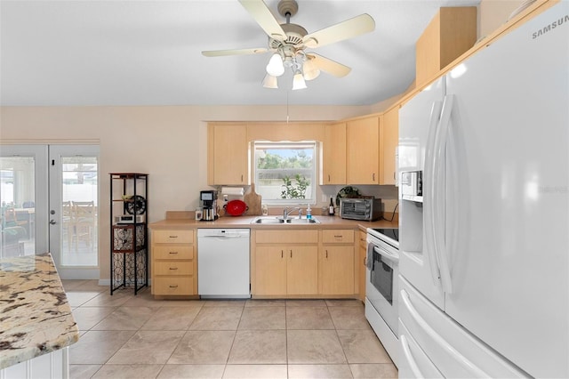 1715 Queen Palm Dr, Edgewater, FL 32132 - kitchen featuring white appliances, light brown cabinets, a sink, light countertops, and light tile patterned flooring
