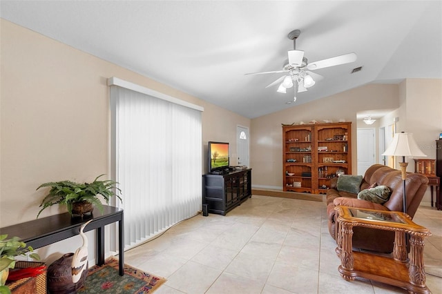 1715 Queen Palm Dr, Edgewater, FL 32132 - living area featuring vaulted ceiling, a ceiling fan, and light tile patterned floors