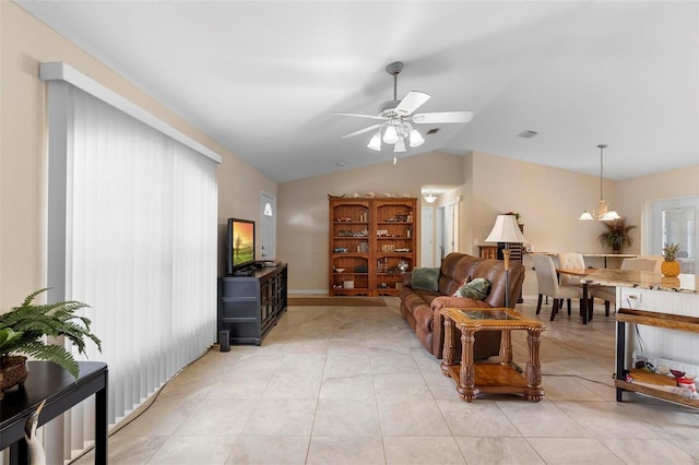 1715 Queen Palm Dr, Edgewater, FL 32132 - living area with vaulted ceiling, light tile patterned floors, and ceiling fan