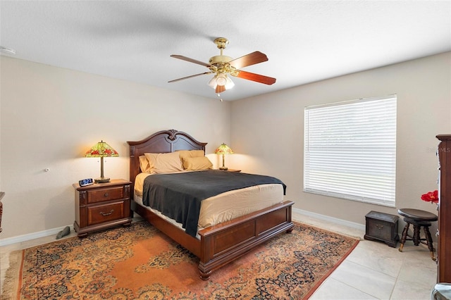 1715 Queen Palm Dr, Edgewater, FL 32132 - bedroom featuring baseboards, ceiling fan, and light tile patterned floors