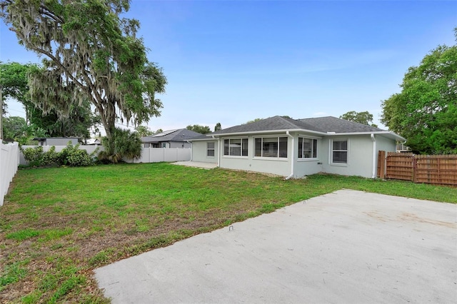 1715 Queen Palm Dr, Edgewater, FL 32132 - rear view of property with a patio and stucco siding