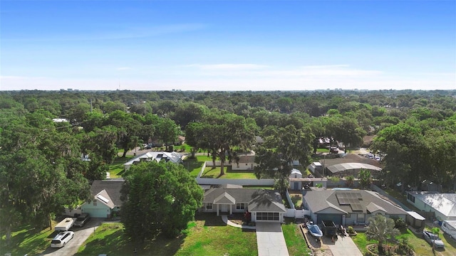 1715 Queen Palm Dr, Edgewater, FL 32132 - aerial perspective of suburban area with a heavily wooded area