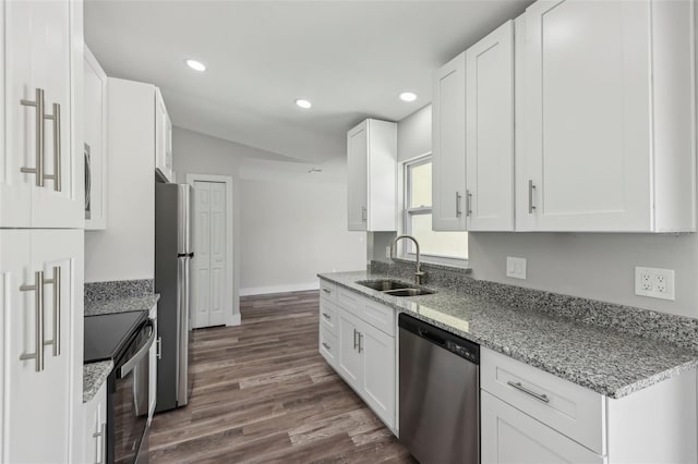 kitchen featuring recessed lighting, white cabinetry, appliances with stainless steel finishes, and a sink