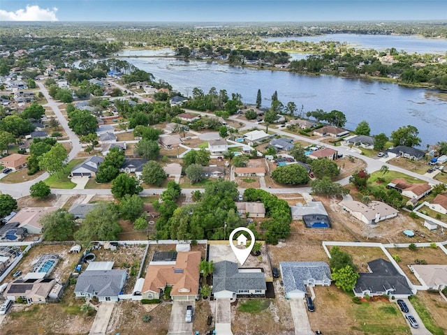 aerial view with a water view and a residential view