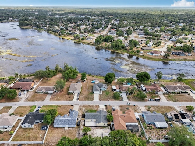 drone / aerial view with a water view and a residential view