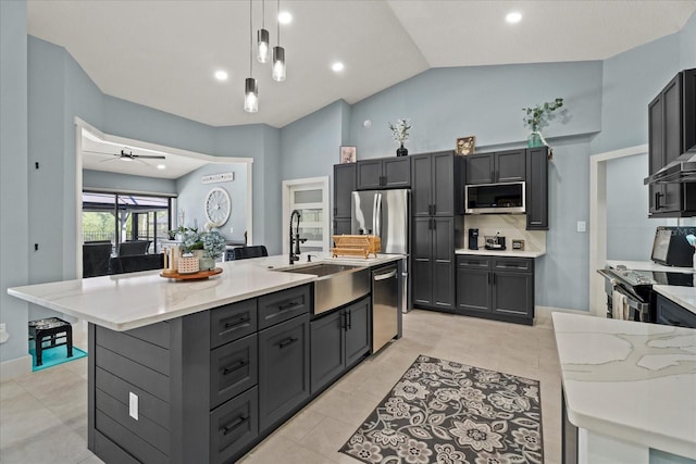 1446 Stone Trl, Enterprise, FL 32725 - kitchen featuring a ceiling fan, hanging light fixtures, a sink, a kitchen island with sink, and appliances with stainless steel finishes