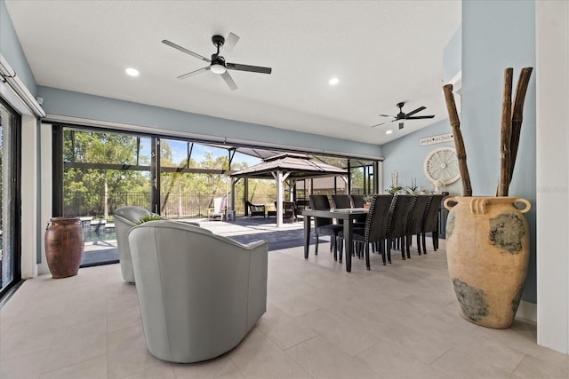 1446 Stone Trl, Enterprise, FL 32725 - living area with a sunroom, light tile patterned floors, a ceiling fan, and recessed lighting