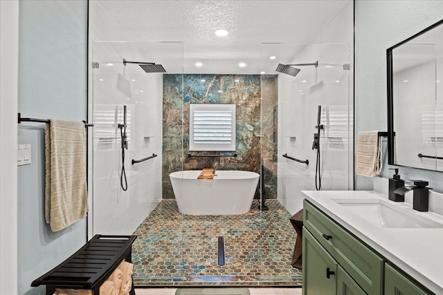1446 Stone Trl, Enterprise, FL 32725 - bathroom featuring a walk in shower, a textured ceiling, and vanity