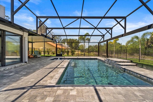 1446 Stone Trl, Enterprise, FL 32725 - view of swimming pool featuring a patio area, a fenced in pool, fence, and a lanai