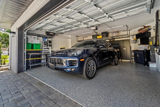 1446 Stone Trl, Enterprise, FL 32725 - garage featuring a garage door opener