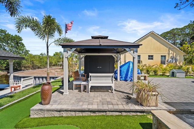 1446 Stone Trl, Enterprise, FL 32725 - view of patio with a gazebo, an outdoor structure, and a storage shed