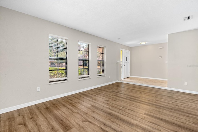 5788 Devon St, Port Orange, FL 32127 - spare room with wood finished floors and baseboards