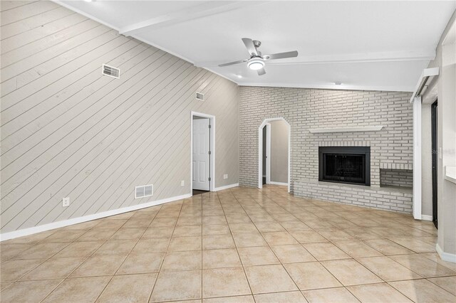 5788 Devon St, Port Orange, FL 32127 - unfurnished living room with a ceiling fan, light tile patterned flooring, and a brick fireplace
