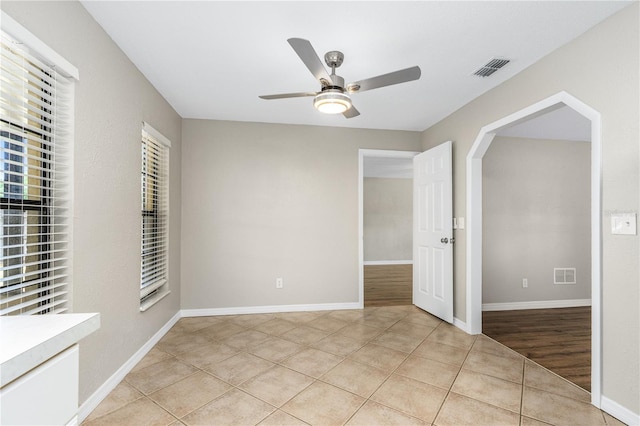 5788 Devon St, Port Orange, FL 32127 - spare room with ceiling fan, light tile patterned floors, and baseboards