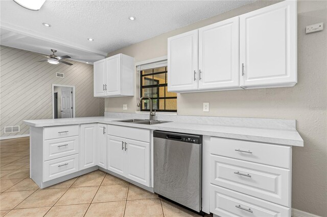 5788 Devon St, Port Orange, FL 32127 - kitchen with dishwasher, a sink, a peninsula, ceiling fan, and light countertops