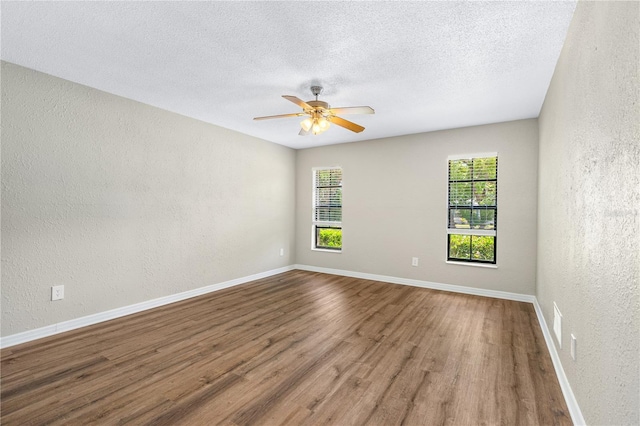 5788 Devon St, Port Orange, FL 32127 - spare room featuring a textured wall, healthy amount of natural light, wood finished floors, ceiling fan, and a textured ceiling