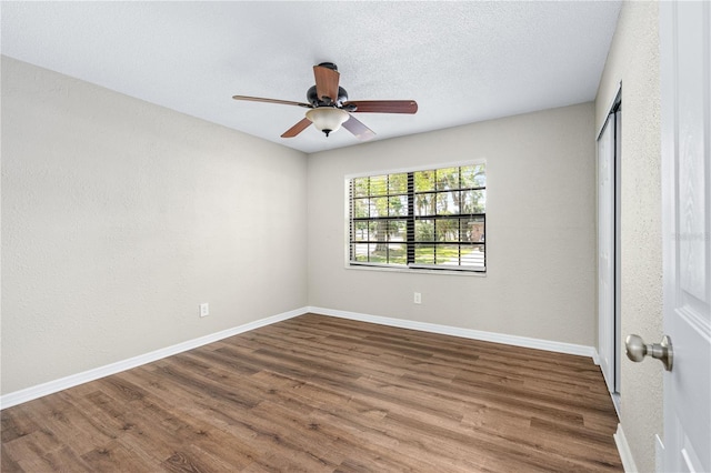 5788 Devon St, Port Orange, FL 32127 - spare room featuring wood finished floors, baseboards, and ceiling fan