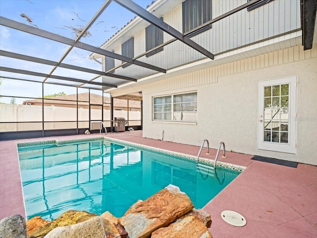 view of pool featuring a fenced in pool, a lanai, and a patio area