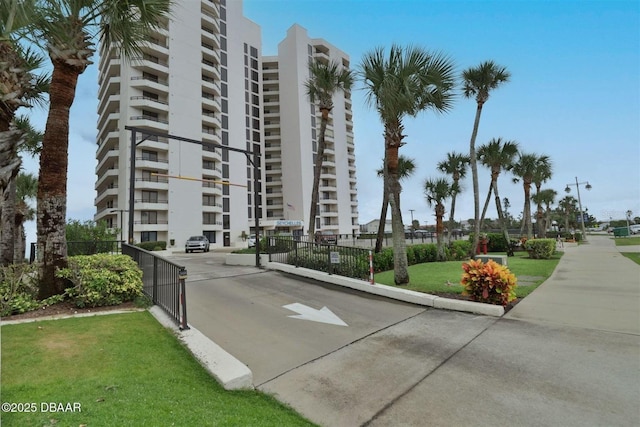 3855 S Atlantic Ave Unit 1405, Daytona Beach, FL 32118 - view of building exterior with fence