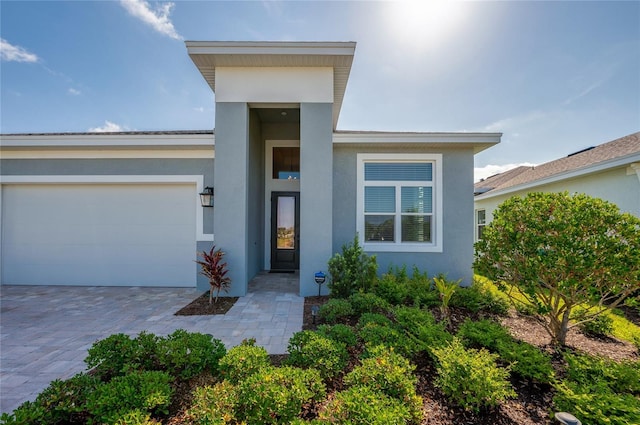 887 Lake Hill Way, Deland, FL 32724 - view of front of house featuring driveway, stucco siding, and a garage