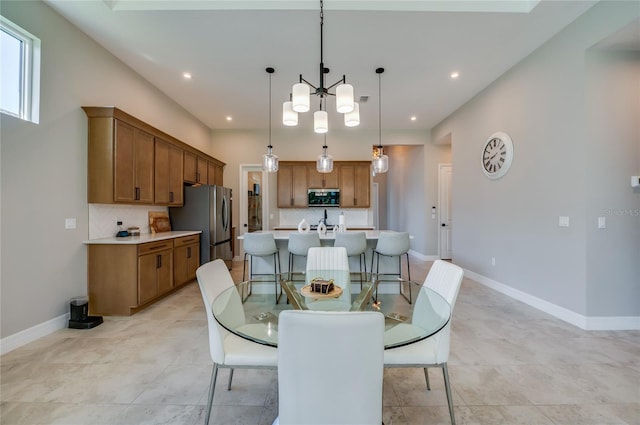 887 Lake Hill Way, Deland, FL 32724 - dining space featuring recessed lighting, baseboards, and a notable chandelier