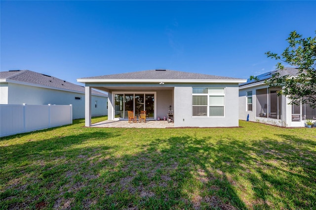887 Lake Hill Way, Deland, FL 32724 - back of property featuring a yard, a patio, stucco siding, and fence