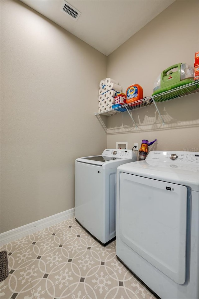 887 Lake Hill Way, Deland, FL 32724 - washroom featuring washer and clothes dryer, laundry area, baseboards, and visible vents