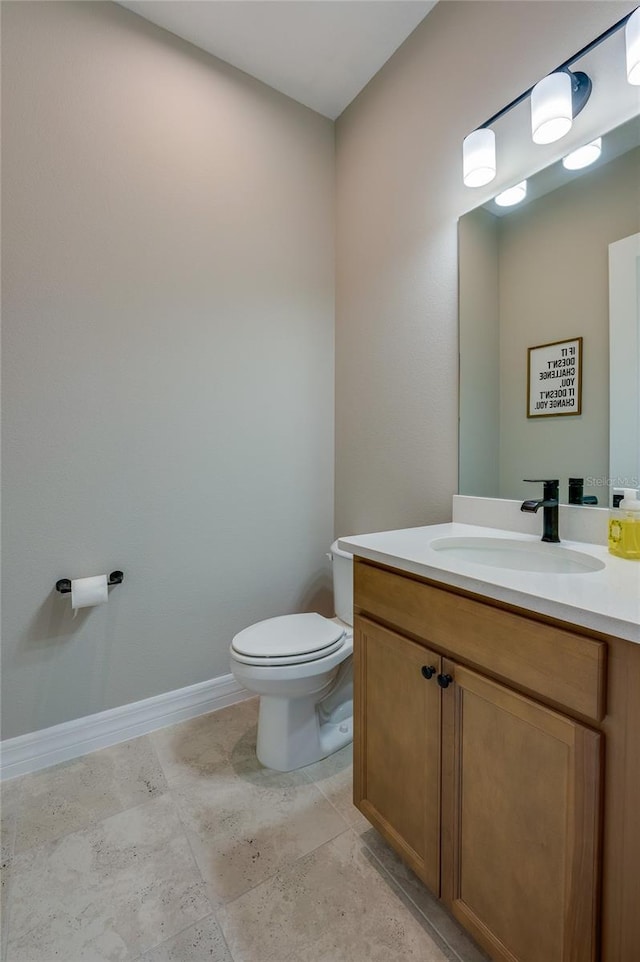 887 Lake Hill Way, Deland, FL 32724 - bathroom with toilet, baseboards, and vanity