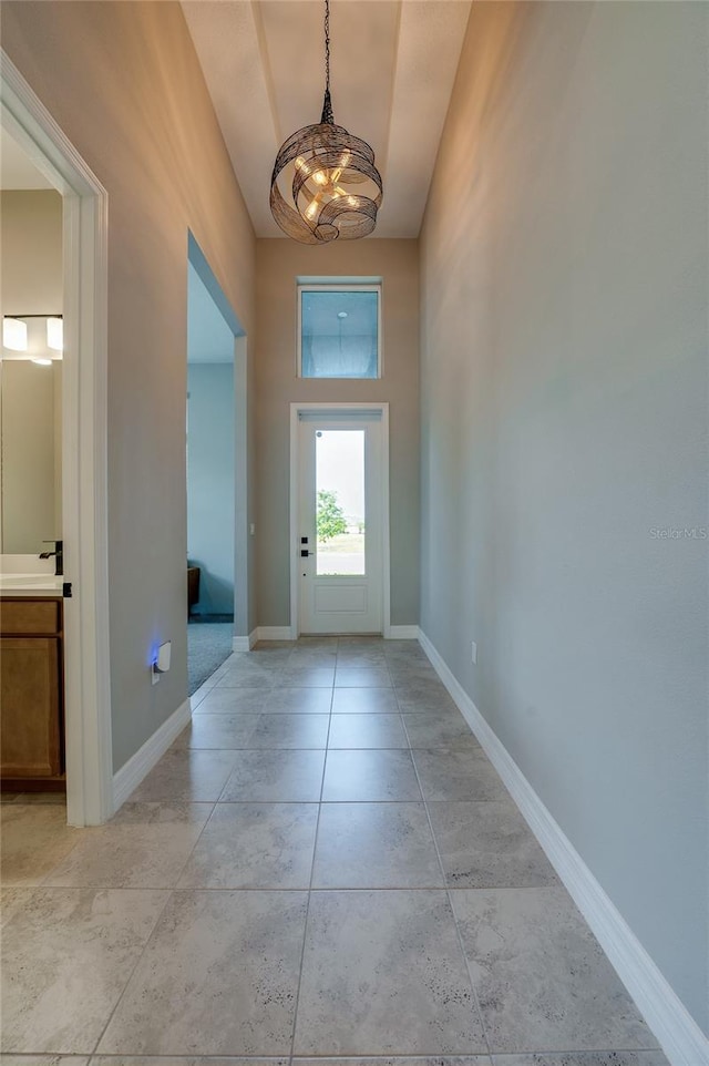 887 Lake Hill Way, Deland, FL 32724 - doorway to outside featuring baseboards