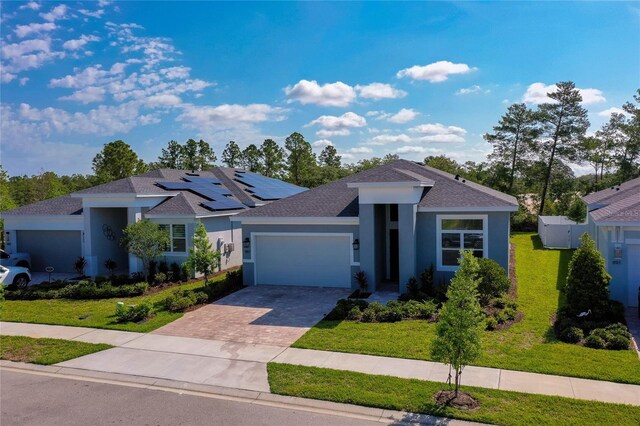 887 Lake Hill Way, Deland, FL 32724 - ranch-style house featuring driveway, a garage, stucco siding, a shingled roof, and a front lawn