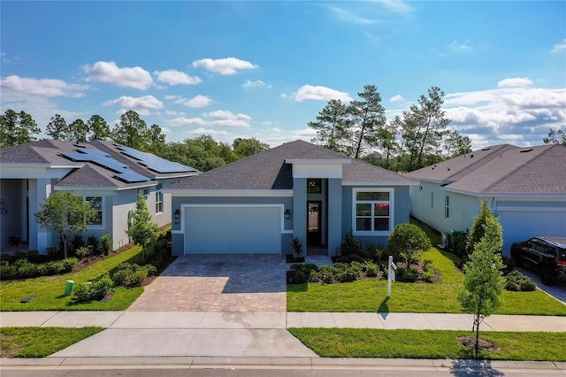 887 Lake Hill Way, Deland, FL 32724 - single story home with decorative driveway, an attached garage, stucco siding, a shingled roof, and a front yard