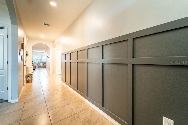 343 Lazio Cir, Debary, FL 32713 - hall featuring arched walkways, light tile patterned flooring, and recessed lighting