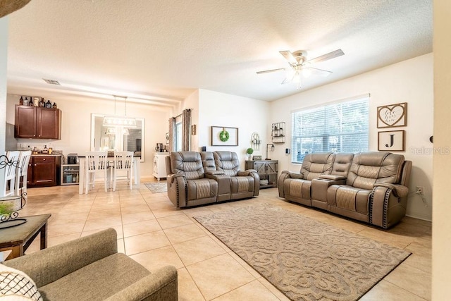 343 Lazio Cir, Debary, FL 32713 - living room featuring light tile patterned flooring, ceiling fan, and a textured ceiling