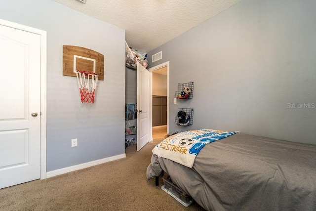 343 Lazio Cir, Debary, FL 32713 - bedroom featuring carpet floors, a textured ceiling, and baseboards