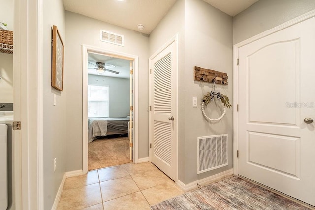 343 Lazio Cir, Debary, FL 32713 - hallway featuring baseboards and light tile patterned flooring