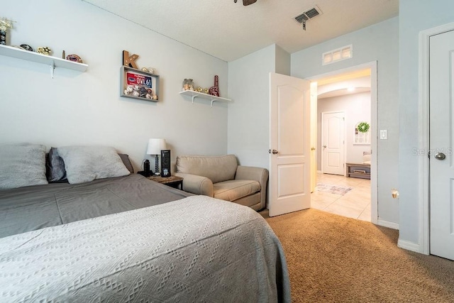 343 Lazio Cir, Debary, FL 32713 - bedroom featuring light colored carpet, light tile patterned floors, and baseboards
