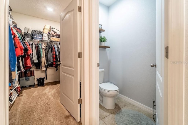 343 Lazio Cir, Debary, FL 32713 - bathroom with a spacious closet, baseboards, and toilet
