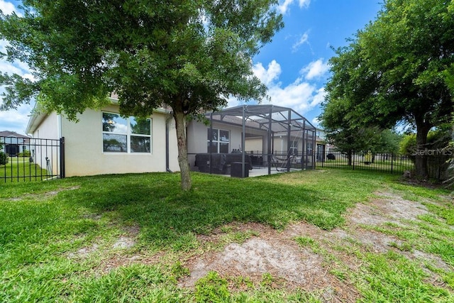 343 Lazio Cir, Debary, FL 32713 - back of house with glass enclosure, stucco siding, and a patio area