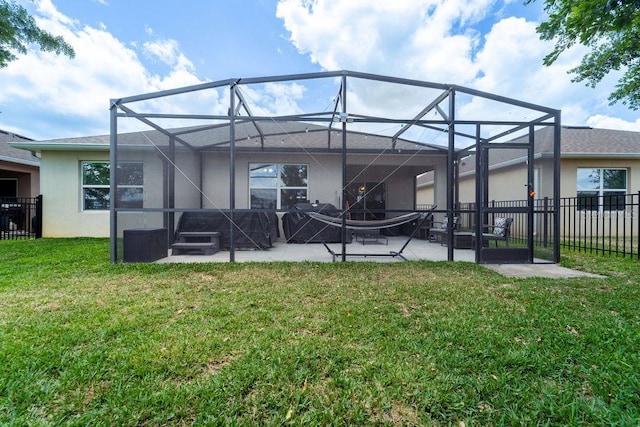 343 Lazio Cir, Debary, FL 32713 - back of property featuring stucco siding, a patio area, and glass enclosure