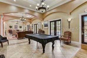 343 Lazio Cir, Debary, FL 32713 - rec room featuring french doors, a chandelier, recessed lighting, crown molding, and a raised ceiling