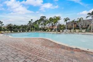 343 Lazio Cir, Debary, FL 32713 - community pool featuring a patio area