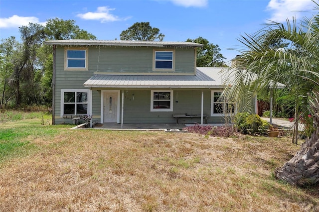 1560 7th Ave, Deland, FL 32724 - view of front of home featuring a front lawn and metal roof