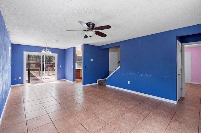 1560 7th Ave, Deland, FL 32724 - empty room with a textured ceiling, ceiling fan, a chandelier, light tile patterned floors, and baseboards
