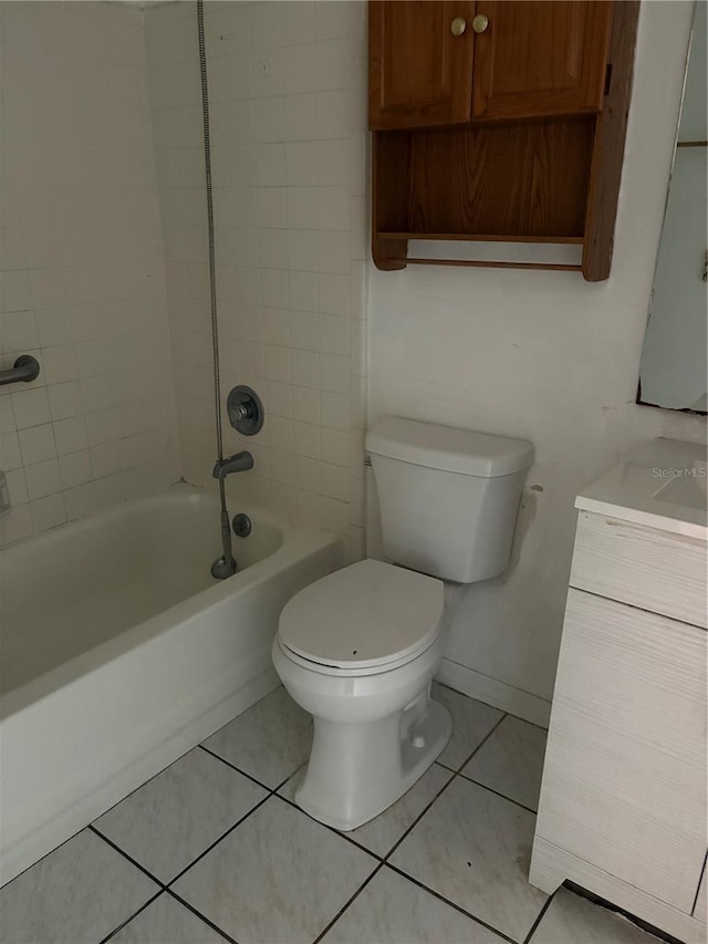bathroom featuring toilet, tile patterned floors, shower / bathtub combination, and vanity