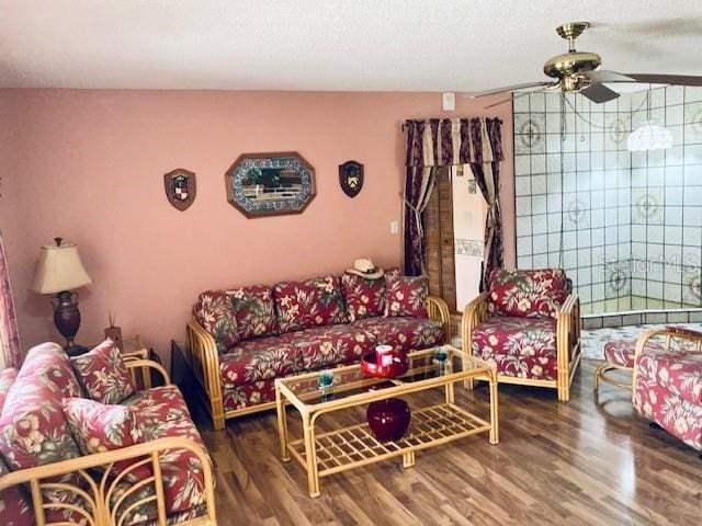 living room featuring ceiling fan and wood finished floors