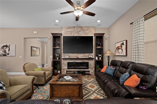 living room featuring baseboards, ceiling fan, a fireplace, and recessed lighting
