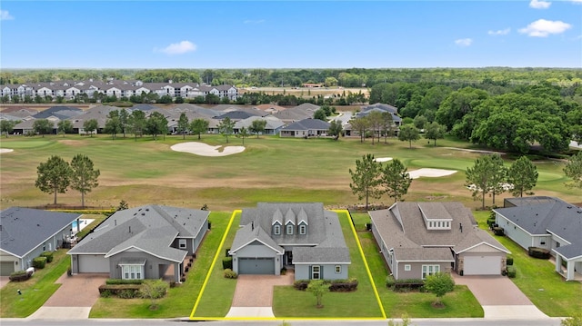 birds eye view of property with a residential view and view of golf course