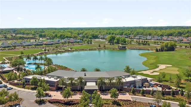 bird's eye view with a water view, view of golf course, and a residential view